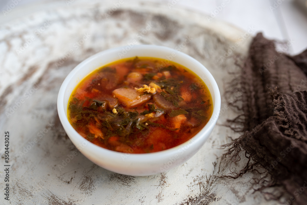 Russian borscht with sorrel and fresh garlic knots pamopushkas. hot soup with egg version. Sorrel soup. Russian borscht with sorrel and fresh garlic knots pamopushkas. hot soup with egg version. Sorrel soup.