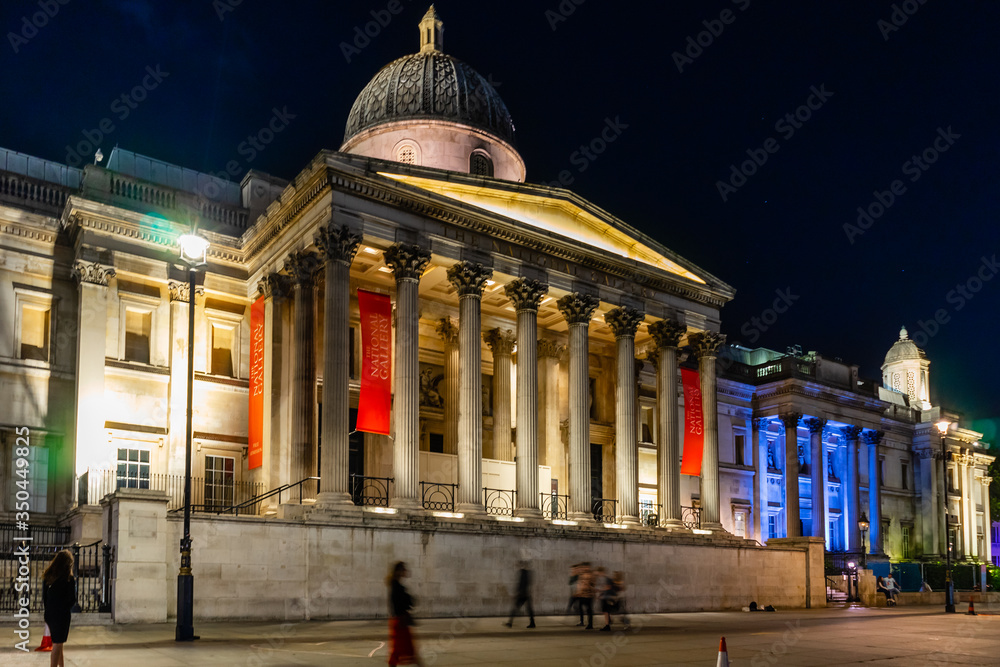 The National Gallery, Trafalgar Square at night in London, England, UK.