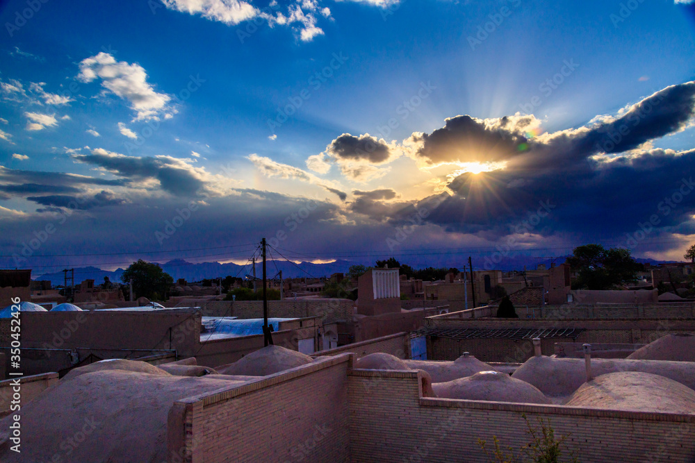 ancient village in Yazd-Iran in a lovely day with beautiful and colorful sky and amazing sunset.