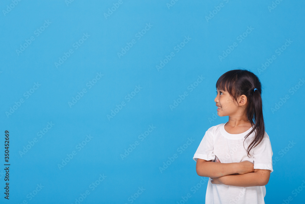 Happiness person healthcare concept. Close up portrait tender gentle charming concentrated stylish glamorous standing with folded arms girl isolated on blue background Happiness person healthcare concept. Close up portrait tender gentle charming concentrated stylish glamorous standing with folded arms girl isolated on blue background