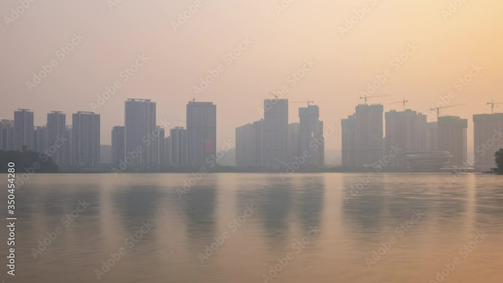 sunset time changsha city lake coastline mega construction modern pier panorama timelapse 4k china