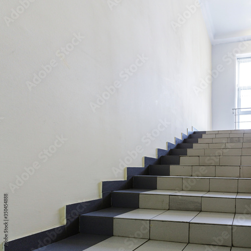 The interior staircase between floors in high-rise building