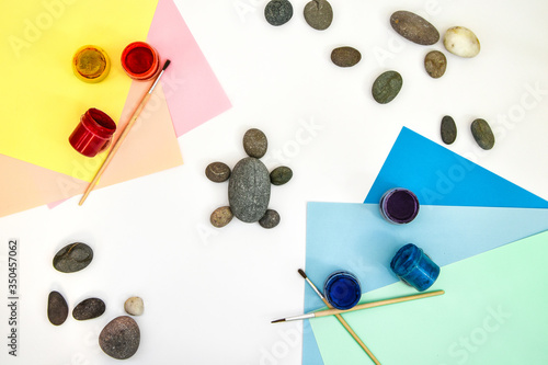 Painting a rock green turtle on a stone step by step. Children art project. DIY concept. Step by step 2 photo instruction. photo