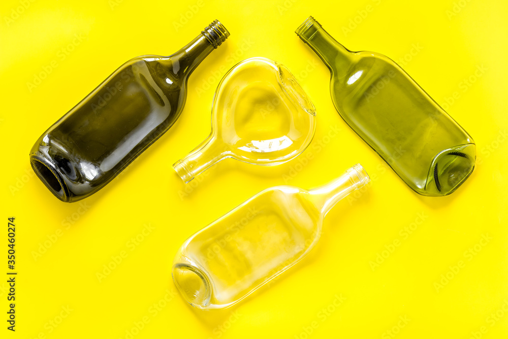 Fototapeta premium Pattern of bottles on yellow background top view