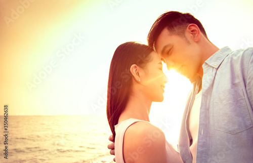 loving asian young couple kissing at sunset. Valentine's day.