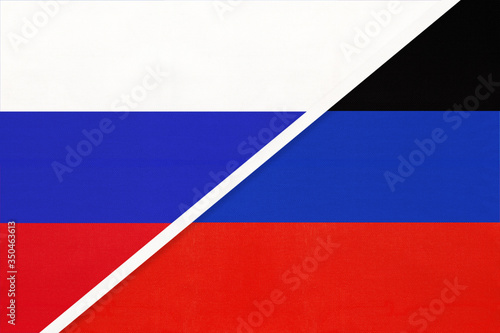 Russia or Russian Federation and Donetsk People's Republic or DNR, symbol of two national flags from textile.