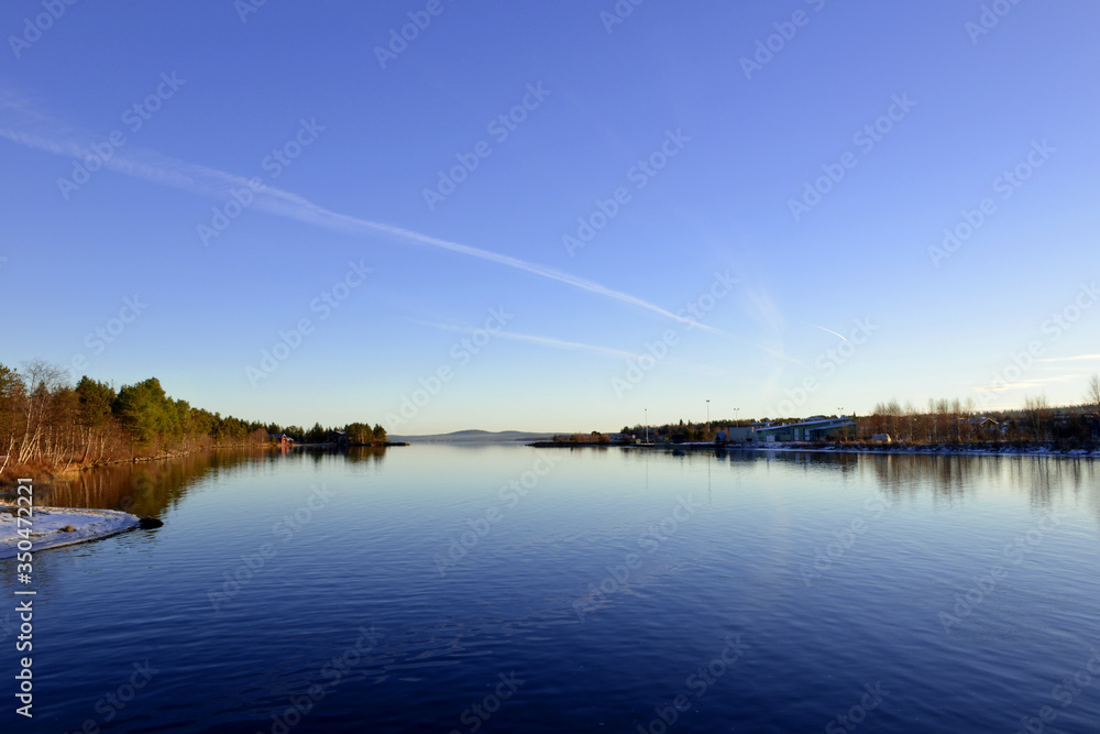 Lake Inari with clear blue sky in Finland