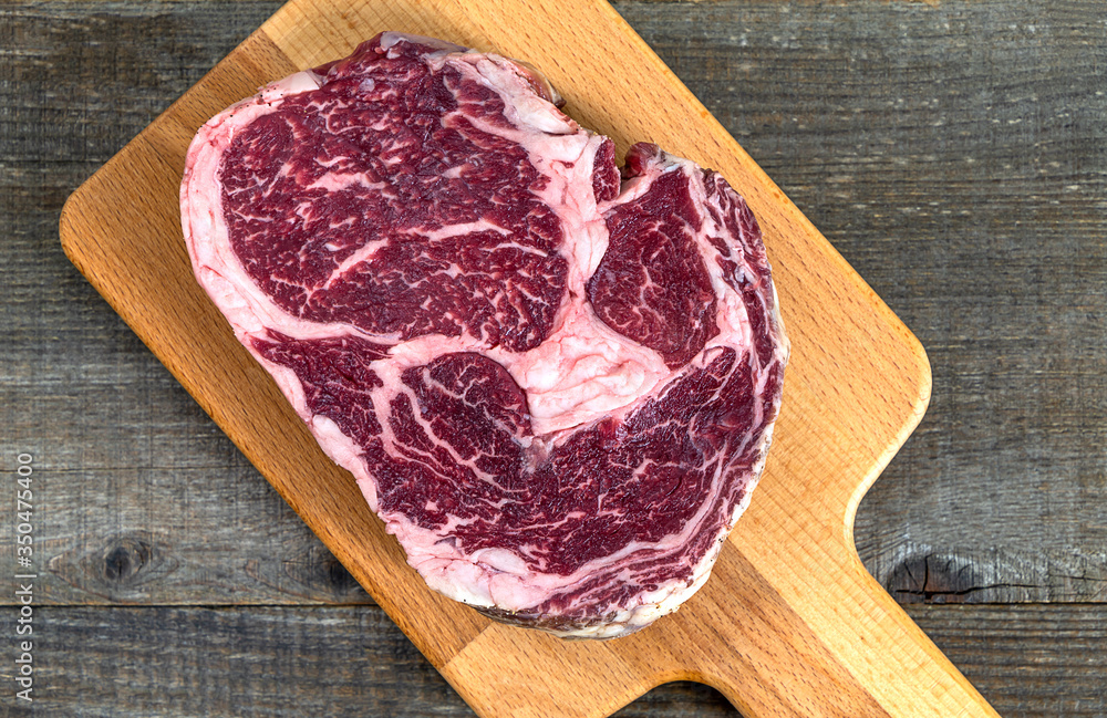 Raw fresh Australian Black Angus Rib Eye steak close up. 