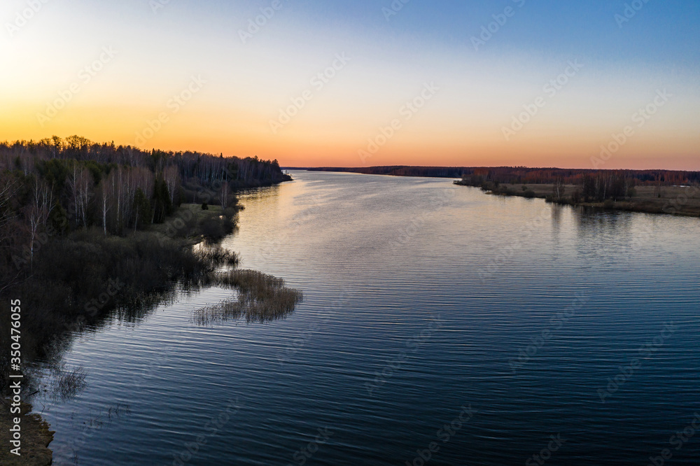 Red-orange sunset on the Uvodsky reservoir Ivanovo region, Russia.