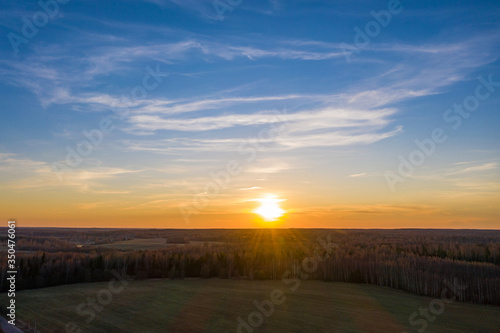 The white disk of the setting sun and the endless fields and forests of Russia.