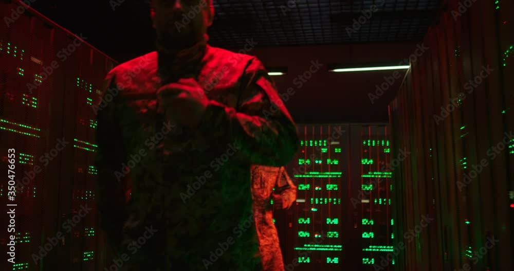 Alert signals in server monitoring room. Mixed-races men and woman running and talking in walkie-talkie while evacuating from data center. Emergency situation concept. Danger alarm Military evacuation Alert signals in server monitoring room. Mixed-races men and woman running and talking in walkie-talkie while evacuating from data center. Emergency situation concept. Danger alarm Military evacuation