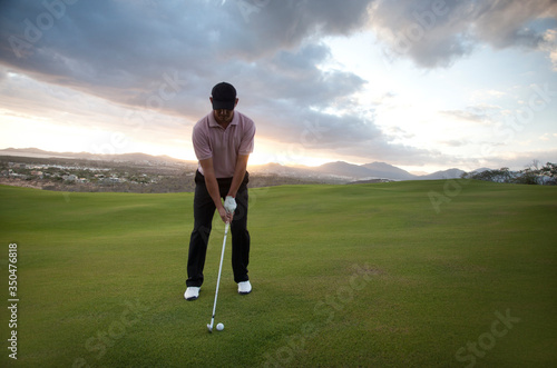 Man playing golf.