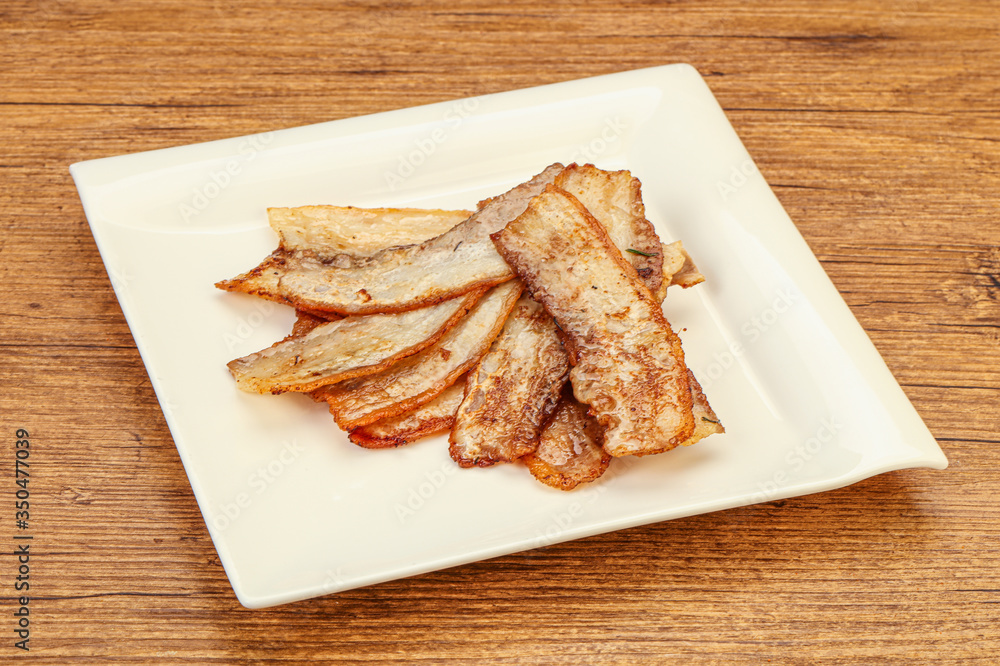 Roasted juicy bacon in the plate Roasted juicy bacon in the plate