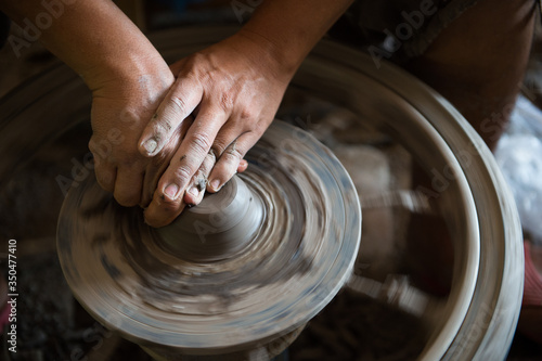 Closeup of sculptor man hand with him job