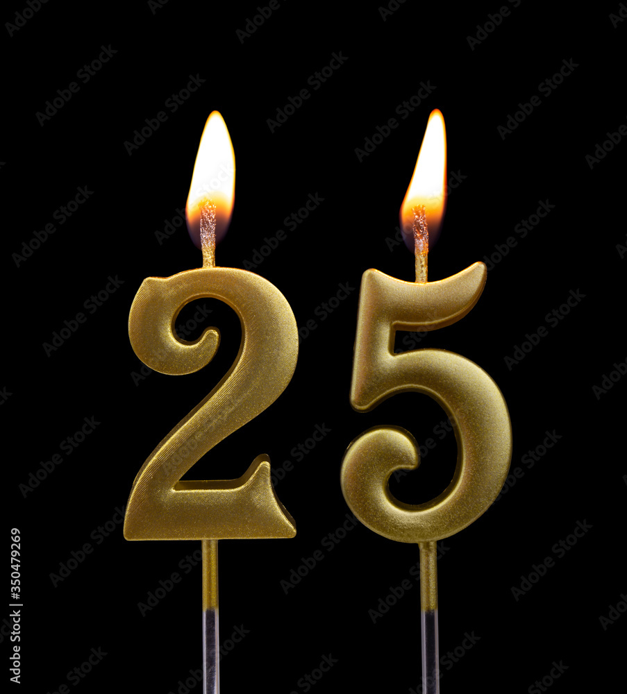 Burning golden birthday candles on black background, number 25 Burning golden birthday candles on black background, number 25