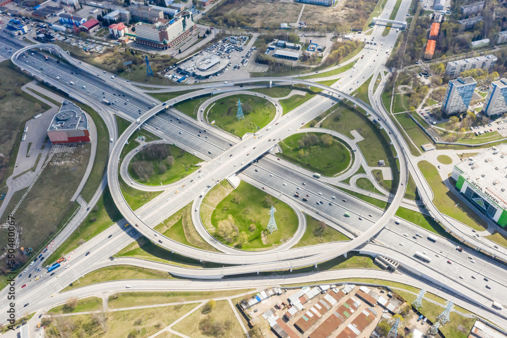 Top view of the multi-level road junction in Moscow from above, car traffic and many cars, the concept of transportation. road junction at the intersection of the Kashirskoe highway and ring road Top view of the multi-level road junction in Moscow from above, car traffic and many cars, the concept of transportation. road junction at the intersection of the Kashirskoe highway and ring road