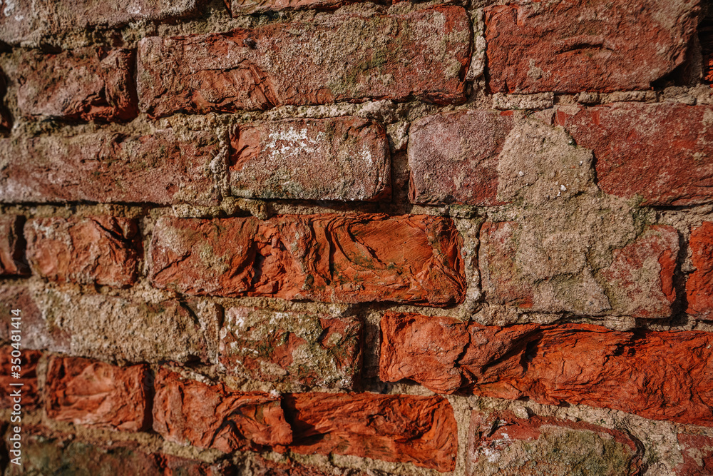 Texture of an old brick wall, background of red bricks Texture of an old brick wall, background of red bricks