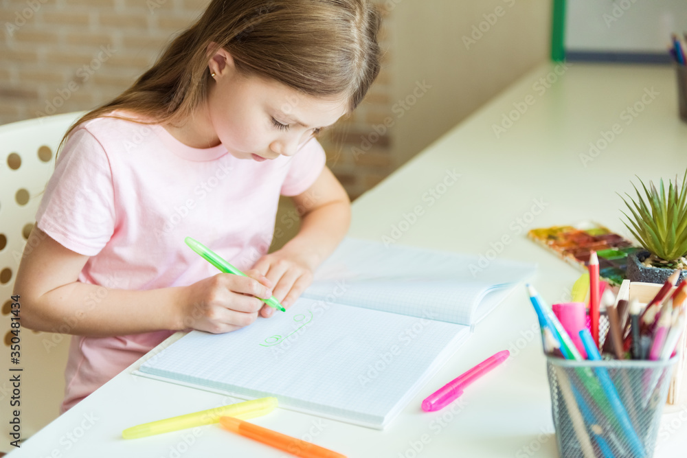 Cute little child girl drawing at home Cute little child girl drawing at home