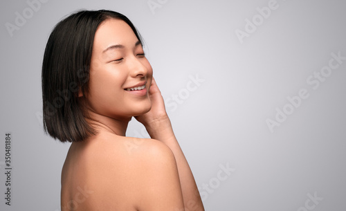 Ethnic model touching clean skin