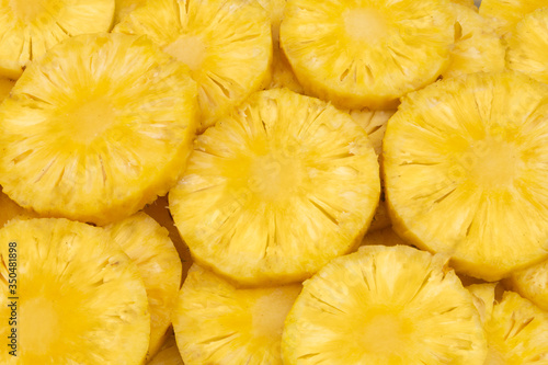 Pineapple slices as background 
