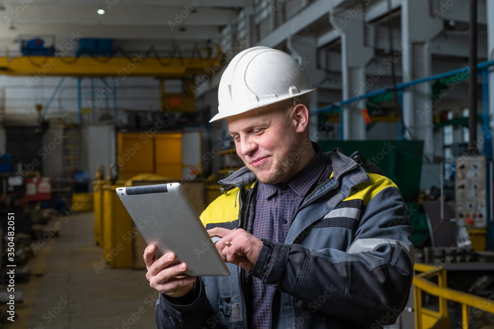 Engineer in a modern factory. The photo illustrates new technologies and production. Engineer in a modern factory. The photo illustrates new technologies and production.