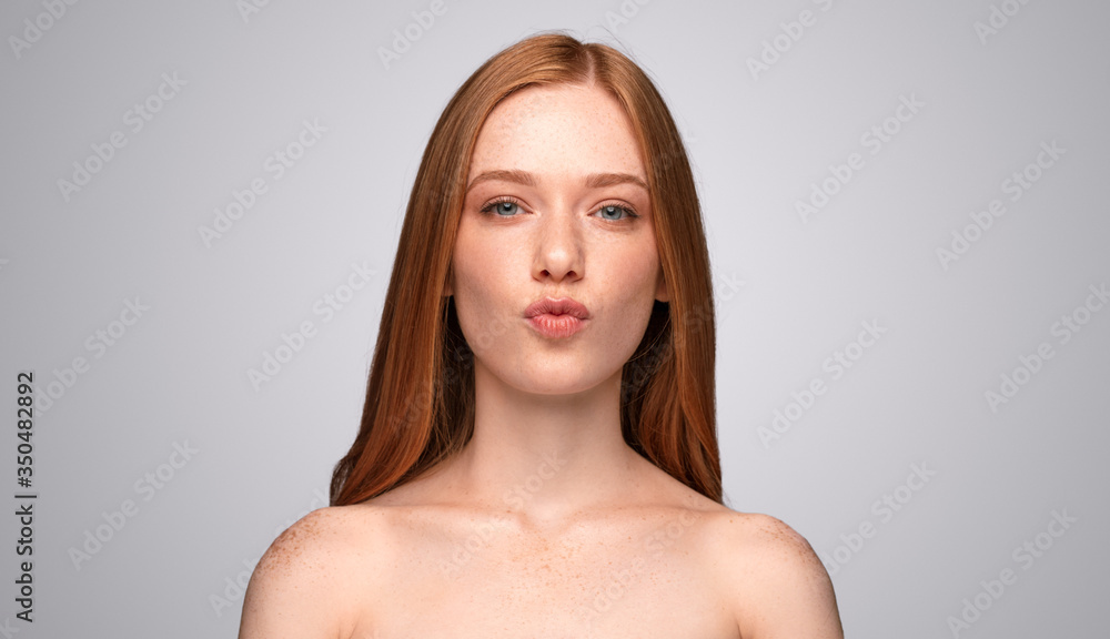 Ginger female model pouting lips Ginger female model pouting lips