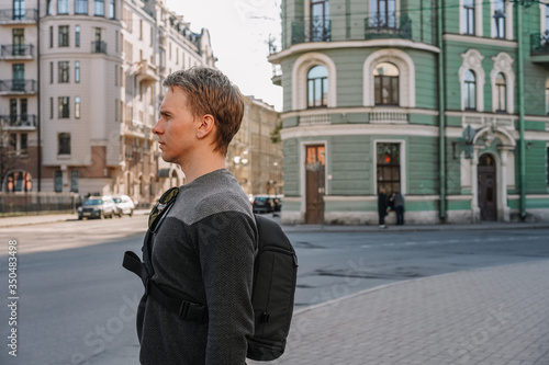 A young man walks along a deserted street in Saint Petersburg, a city during self-isolation from the coronavirus
