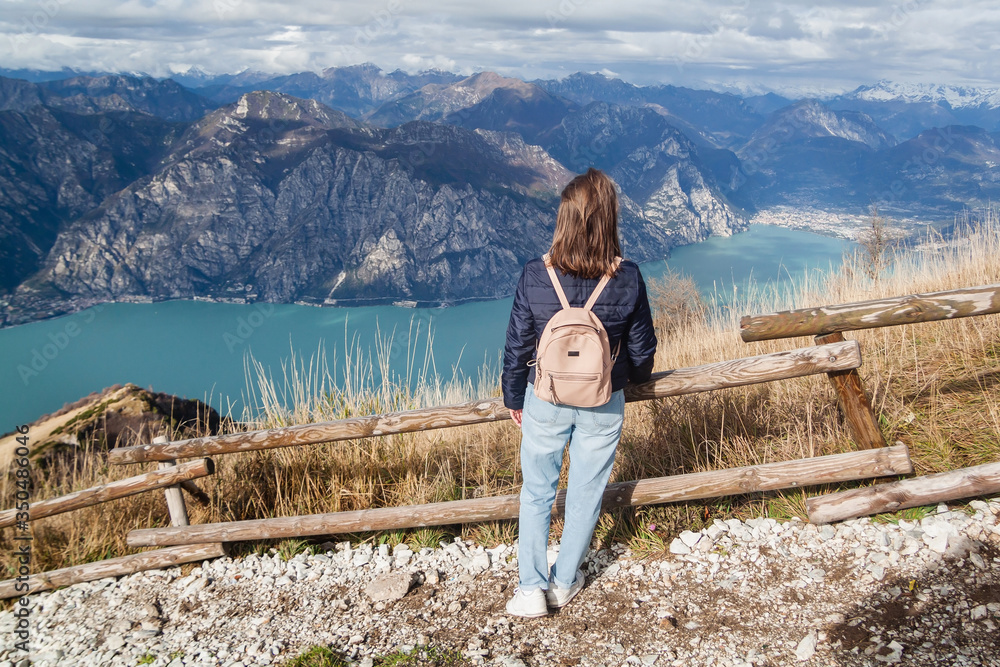 Tourist on viewpoint of Monte Baldo on Lake Garda in autumn Tourist on viewpoint of Monte Baldo on Lake Garda in autumn