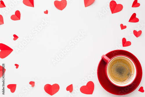 Flat lay of paper heart shapes and coffee for valentines day