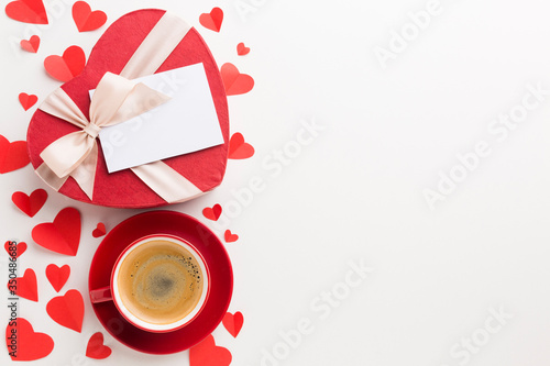 Top view of cup of coffee and valentines day gift