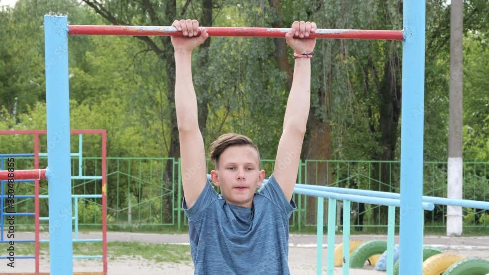 teenager goes in for sports on the playground outdoors teenager goes in for sports on the playground outdoors