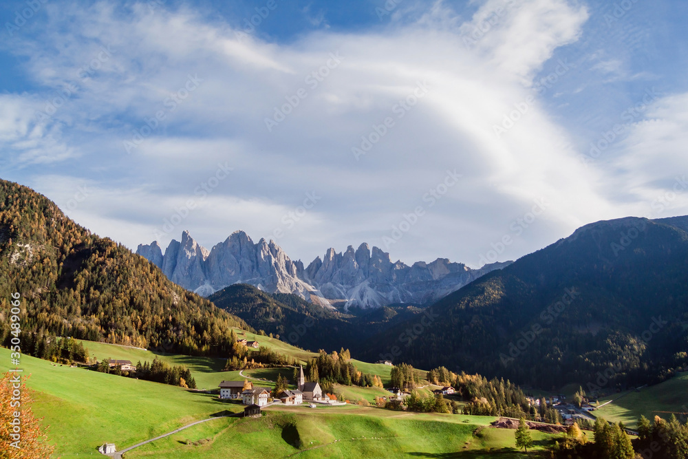 Mountain peaks and the church of Santa Maddalena in Val di Funes, South Tyrol, Italy