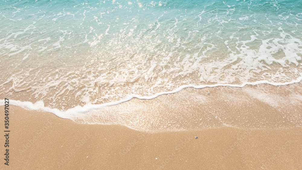 wave of blue ocean on sandy beach. texture Background. wave of blue ocean on sandy beach. texture Background.
