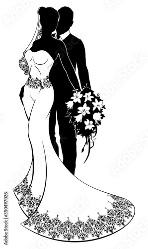 A bride and groom wedding couple in silhouette with the bride in a white bridal dress gown holding a floral bouquet of flowers
