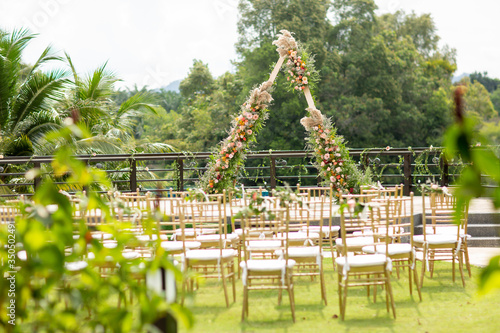 Beautiful and rustic garden wedding setup on a sunny day during summer.