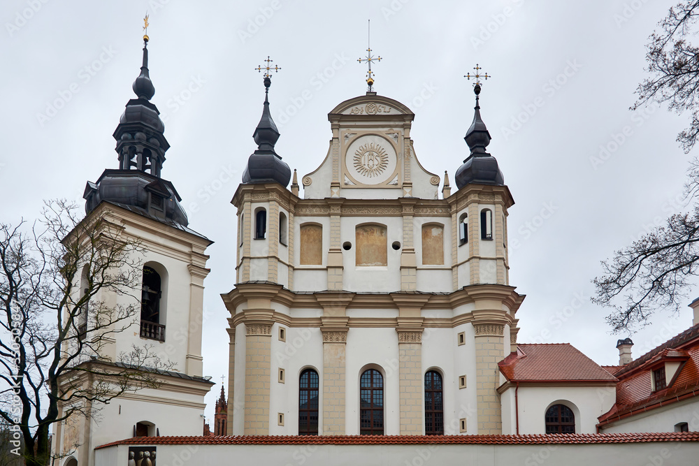 Vilnius, Lithuania - Church of St. Michael, a white-beige building, with transitional features from Gothic to the Renaissance, now it houses the Museum of Church Heritage, in the winter afternoon.