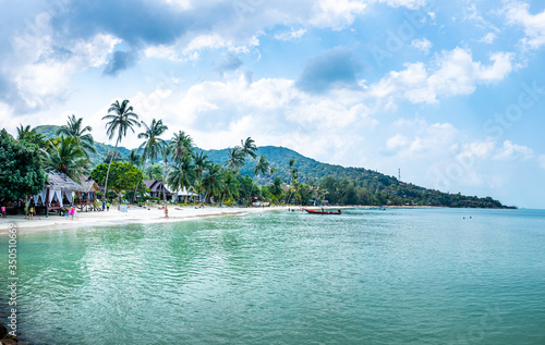  People swim and sunbathe on Haad yao beach, Koh Phangan. © Haluk
