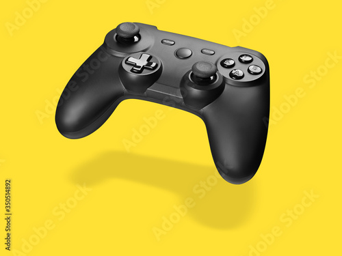 Game controller isolated. Gamepat on yellow background