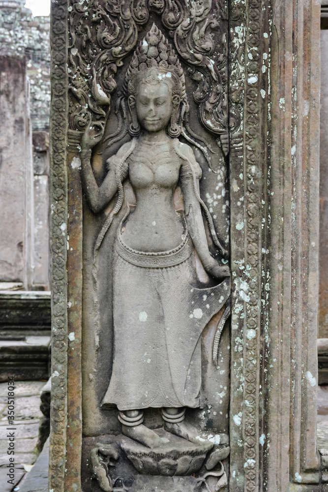 Bas-relief sculpture of a woman in Bayon Temple. Angkor Temples in Cambodia