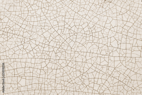 Texture of old white ceramic pottery or tile with cracks, real photo