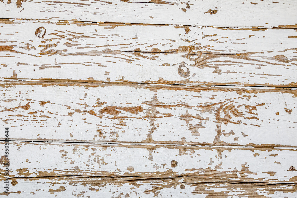 Fototapeta premium Stare pomalowane deski. Łuszcząca się farba. Abstrakcyjne tło.