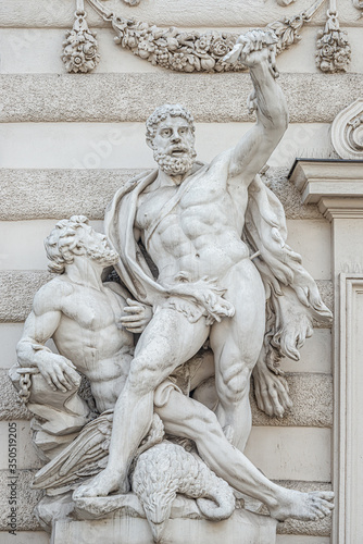 Statue of Hercules killing the eagle and freeing Prometheus from Classical Greek Mythology, Hofburg Palace, outdoor, Vienna, Austria, details, closeup © neurobite