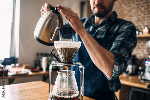 Man prepares coffee in style 
