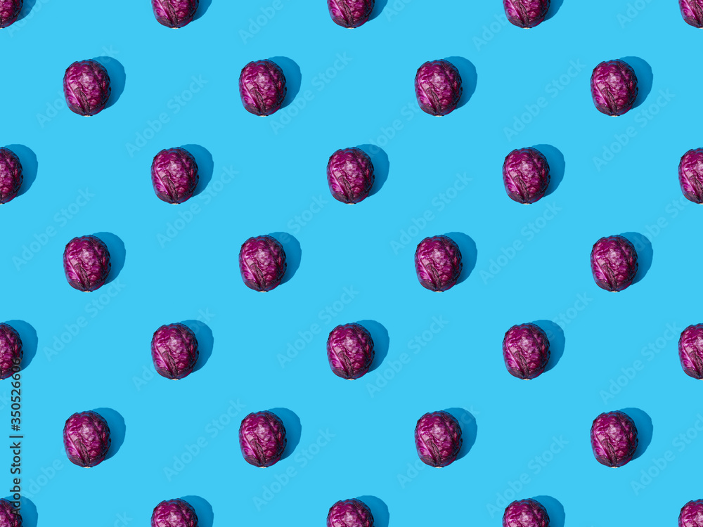 top view of whole ripe red cabbage on blue colorful background, seamless pattern top view of whole ripe red cabbage on blue colorful background, seamless pattern