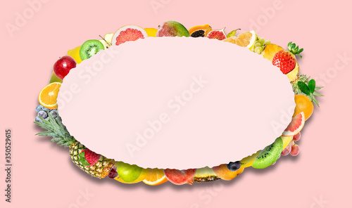 Creative photo of many different exotic tropical bright fruits with shadows on a pink color background and an paper oval with beautiful jagged edges in the center for text. Bright summer pattern.