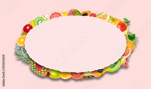 Creative photo of many different exotic tropical bright fruits with shadows on a pink color background and an paper oval with beautiful jagged edges in the center for text. Bright summer pattern.