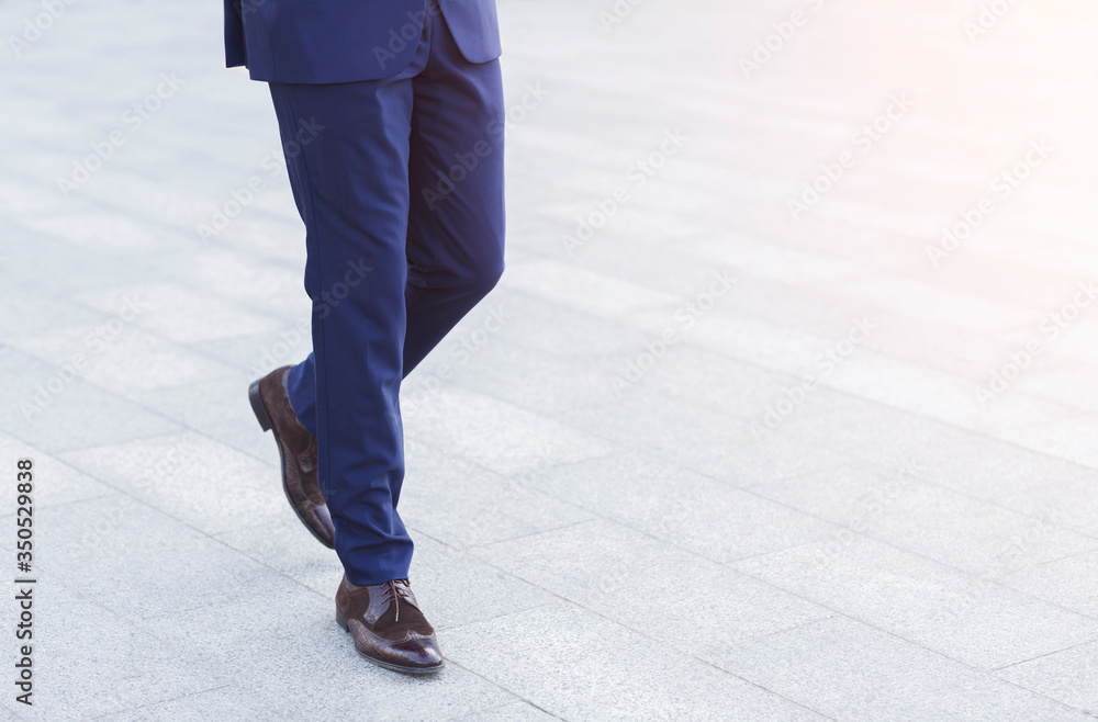 Unrecognizable African Entrepreneur Walking In City Outdoors, Cropped Unrecognizable African Entrepreneur Walking In City Outdoors, Cropped