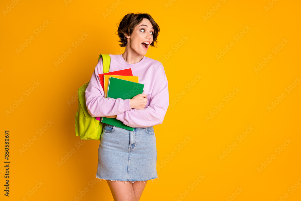 Photo of crazy astonished high school girl hold materials books have bag look copyspace impressed she see her classmate scream wow omg wear jumper denim isolated bright color background Photo of crazy astonished high school girl hold materials books have bag look copyspace impressed she see her classmate scream wow omg wear jumper denim isolated bright color background