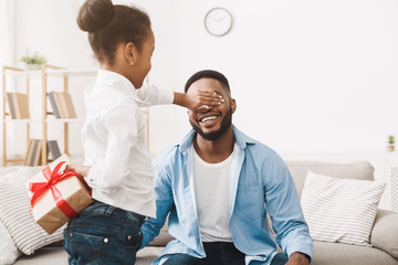 Present For Father. Child Girl Making Surprise For Dad