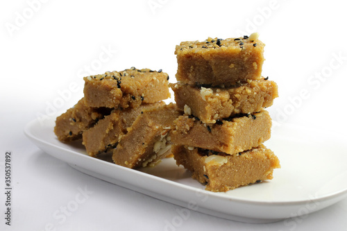 Sukhadi or Gor Papdi is Indian Traditional sweet made with wheat flour,desi ghee,jaggeery and nuts.very healthy Gujarati Mithai photo